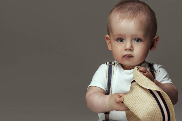 istock Adorable little baby boy posing. 693437104