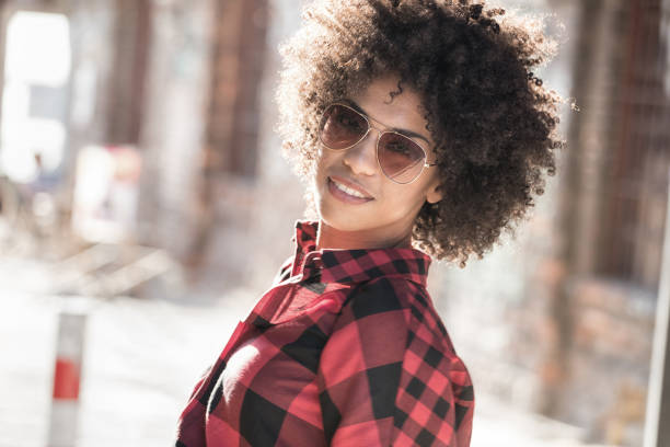 istock Girl with afro hairstyle. 693439570
