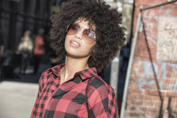 istock Girl with afro hairstyle. 693439734