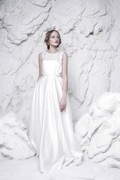 istock snow queen standing in ice and snow 693442978