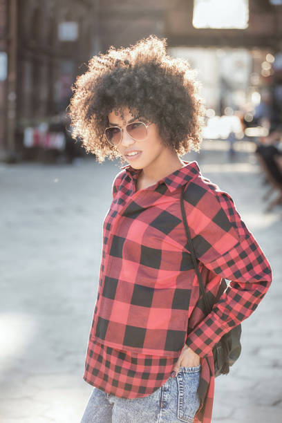 istock Girl with afro hairstyle. 693443080