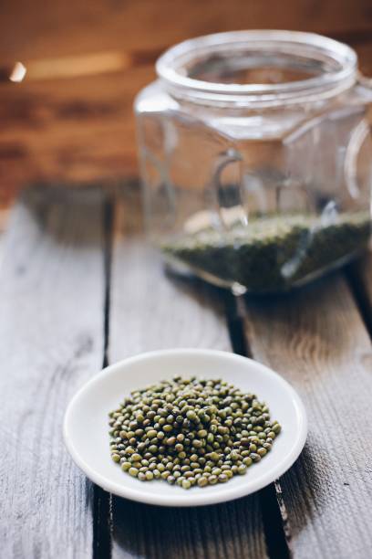 istock Raw green mung beans on small plate 693453782