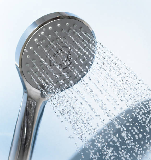 Shower head splashing water. Modern Shower head splashing water close up bathroom designer shower house stock pictures, royalty-free photos & images