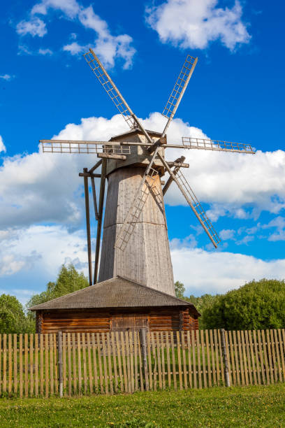 istock Dutch windmill with blue sky and clouds background 693455670