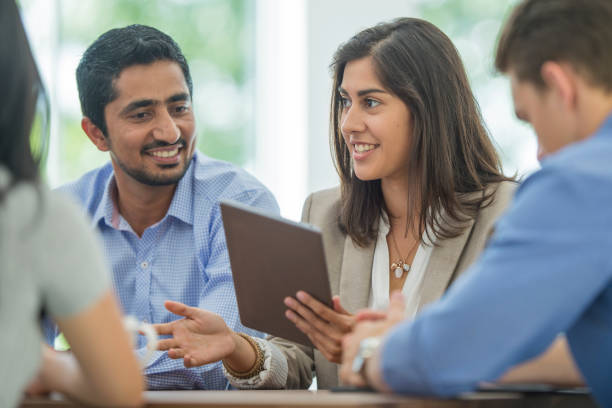 digital technology in a business meeting - asian ethnicity suit business men imagens e fotografias de stock