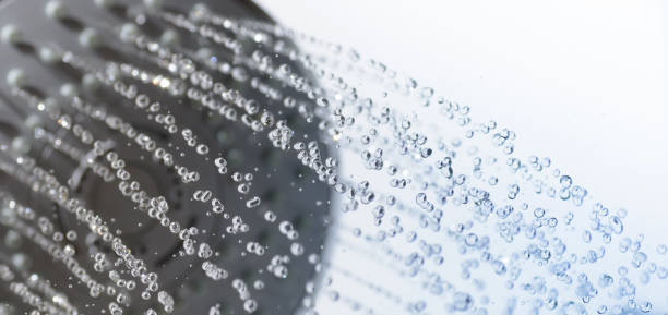 istock Closeup of a shower head and water drops 693474926