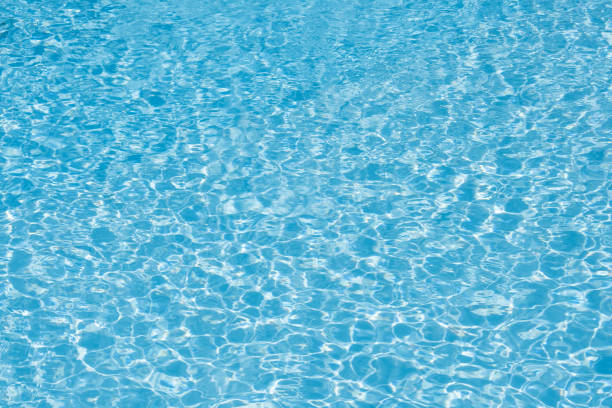 istock Beautiful ripple wave and blue water surface in swimming pool 693493448