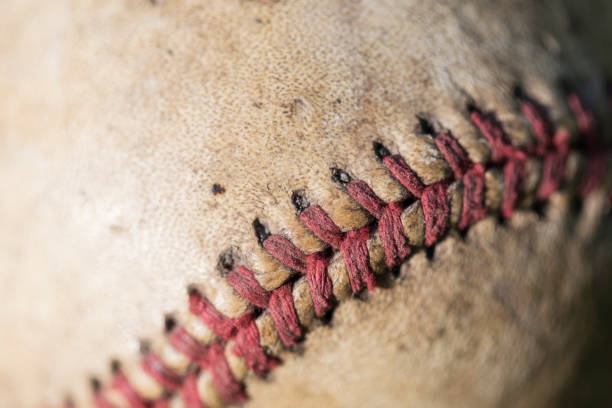 Baseball on a bench at an old wood outdoor dugout