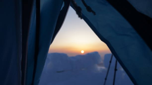 istock The morning sun is judged from a tent. 693512266