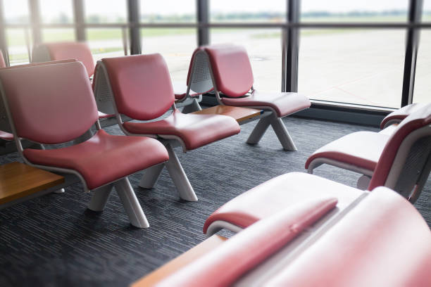 istock Airport Seats Available In Waiting Area 693528428