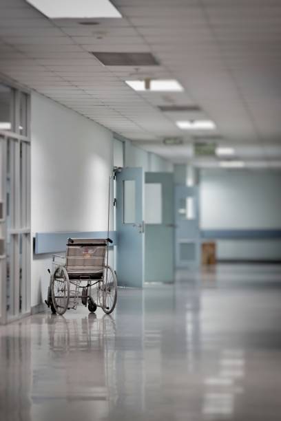 istock Wheelchair empty wait to use at hospital hallway 693528942