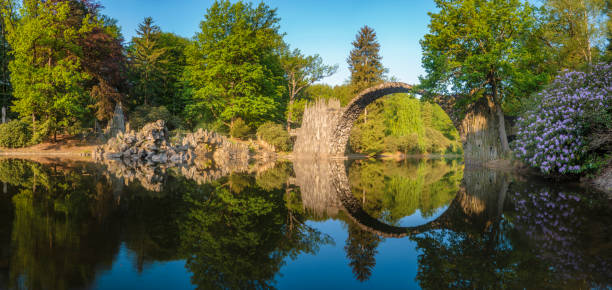 istock Devil's bridge in the park Kromlau, Germany,Flowering rhododendrons 693534502