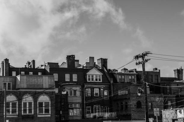 A black and White Photo of the Row houses that line Delaware Avenue in Buffalo NY. Taken from Franklin St.