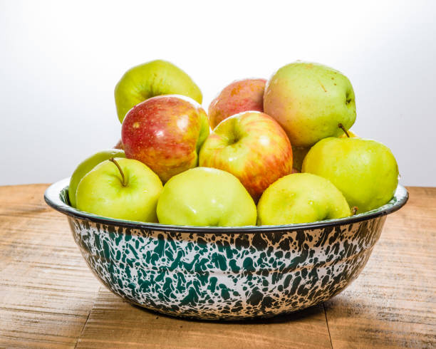 istock Bowl of organic apples on table 693538208