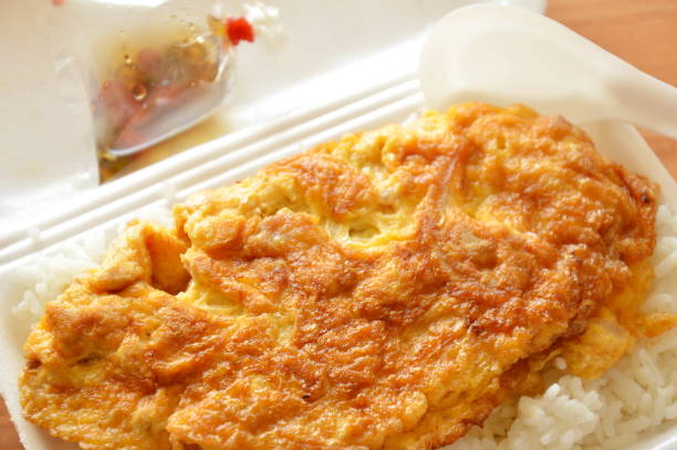 istock omelet on rice in foam box with plastic spoon 693541298
