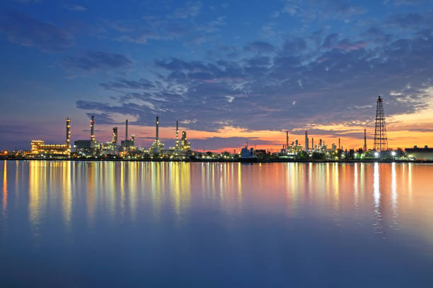 istock Reflection of a refinery with water at dawn 693547570
