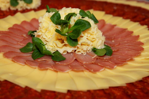 istock Meat platter with cold cuts, cheese and salad as decoration 693548010