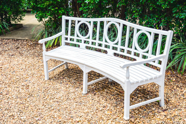 istock white bench in the garden 693553432