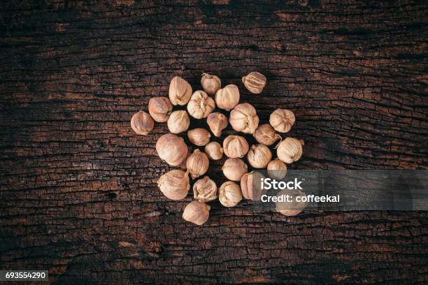 Siam Cardamom Dried On Wood Background Stock Photo - Download Image Now