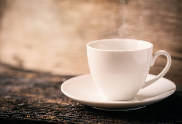 istock Hot Coffee, Espresso Coffee cup. White coffee cup on wood table. 693554944