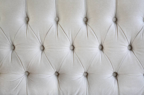 istock vintage style fabric with button texture of sofa. 693560890