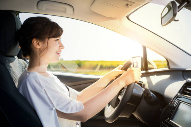 young woman driving a car. - driverless train imagens e fotografias de stock