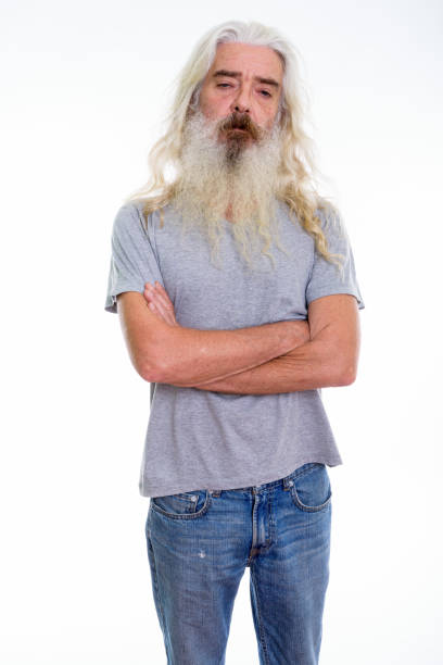istock Studio shot of senior bearded man standing with arms crossed 693569936