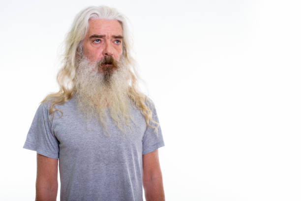 istock Studio shot of senior bearded man thinking while looking at distance 693569942