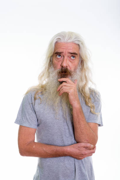 istock Studio shot of senior bearded man thinking while looking up 693570014