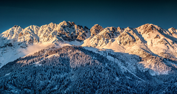 Innsbruck ski resort panorama at sunset in winter time, Tirol, Austria