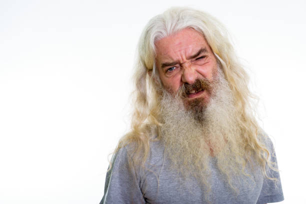 istock Close up of senior bearded man looking disgusted 693573640
