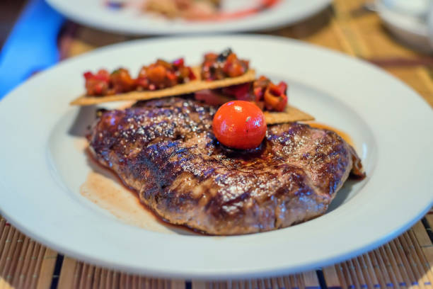 istock Grilled beef with tomato and bruschetta 693573748