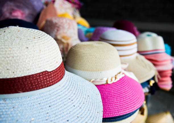 Display of hats for sale in a street market stall.