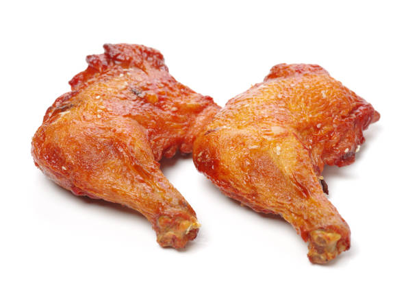 istock deep fry chicken thigh isolated on white 693582434
