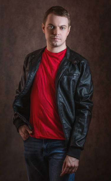 istock Man in a red T-shirt and a black jacket. 693583348
