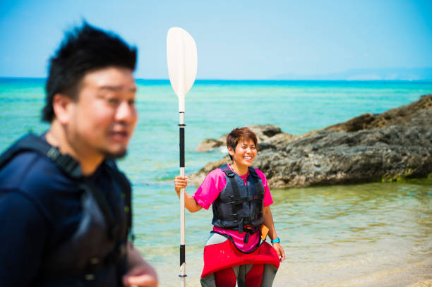 istock Friends playing at the beach in Okinawa 693583510
