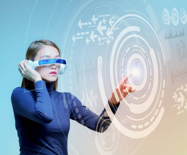 istock woman wearing smart glasses and futuristic graphical user interface 693585882