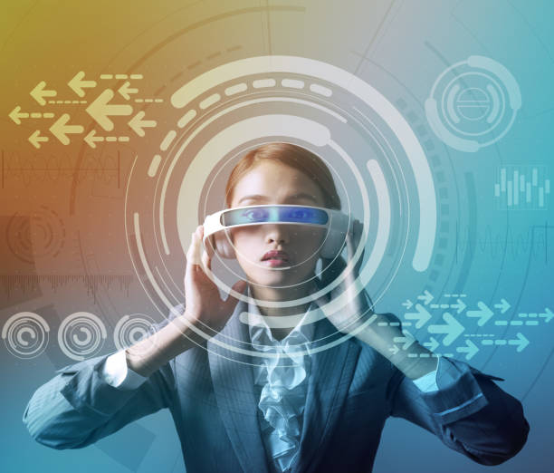 istock woman wearing smart glasses and futuristic graphical user interface 693586002