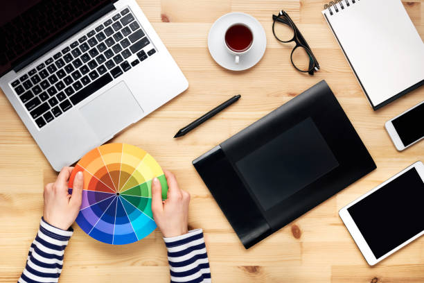 Designer's working table with laptop and tablet stock photo
