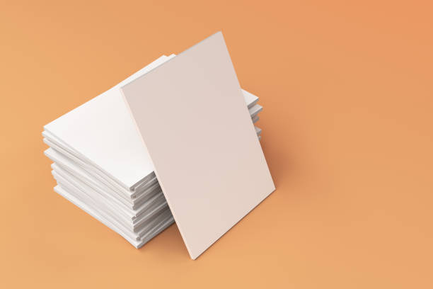 istock Stack of blank white closed brochure mock-up on orange background 693599560