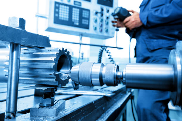 istock Man operating CNC drilling and boring machine. Industry 693599950