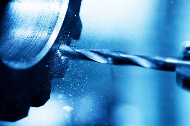istock CNC turning, drilling and boring machine at work close-up 693599954