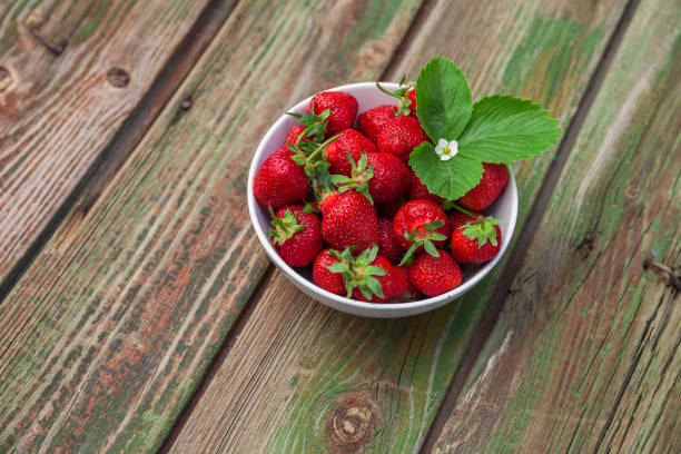 istock Fresh strawberry on wooden background,with copy space. 693604988