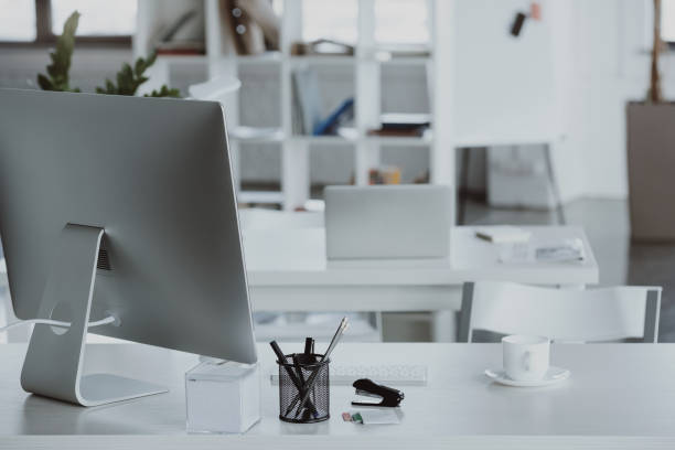 istock workplace with computer monitor, coffee cup and office supplies in office 693610340