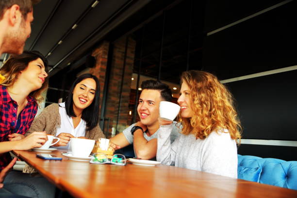 istock Group of people resting in the cafe 693611368