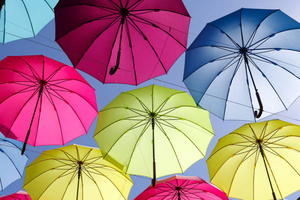 istock colorful umbrella on the sky 693613922