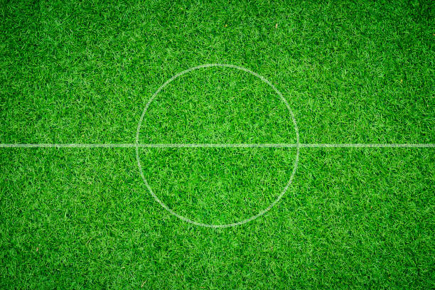 istock soccer field center and ball top view background 693614174