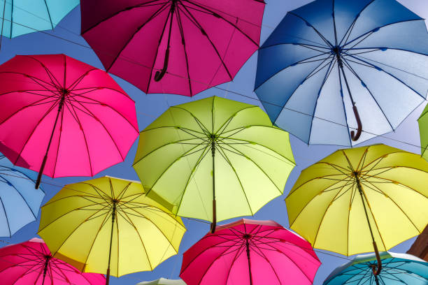 istock colorful umbrella on the sky 693620142
