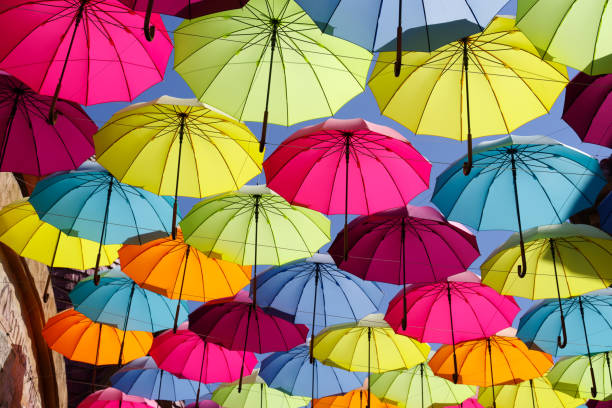 istock colorful umbrella on the sky 693620462