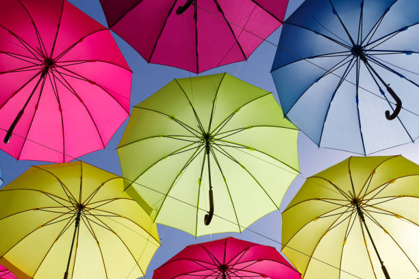istock colorful umbrella on the sky 693623202